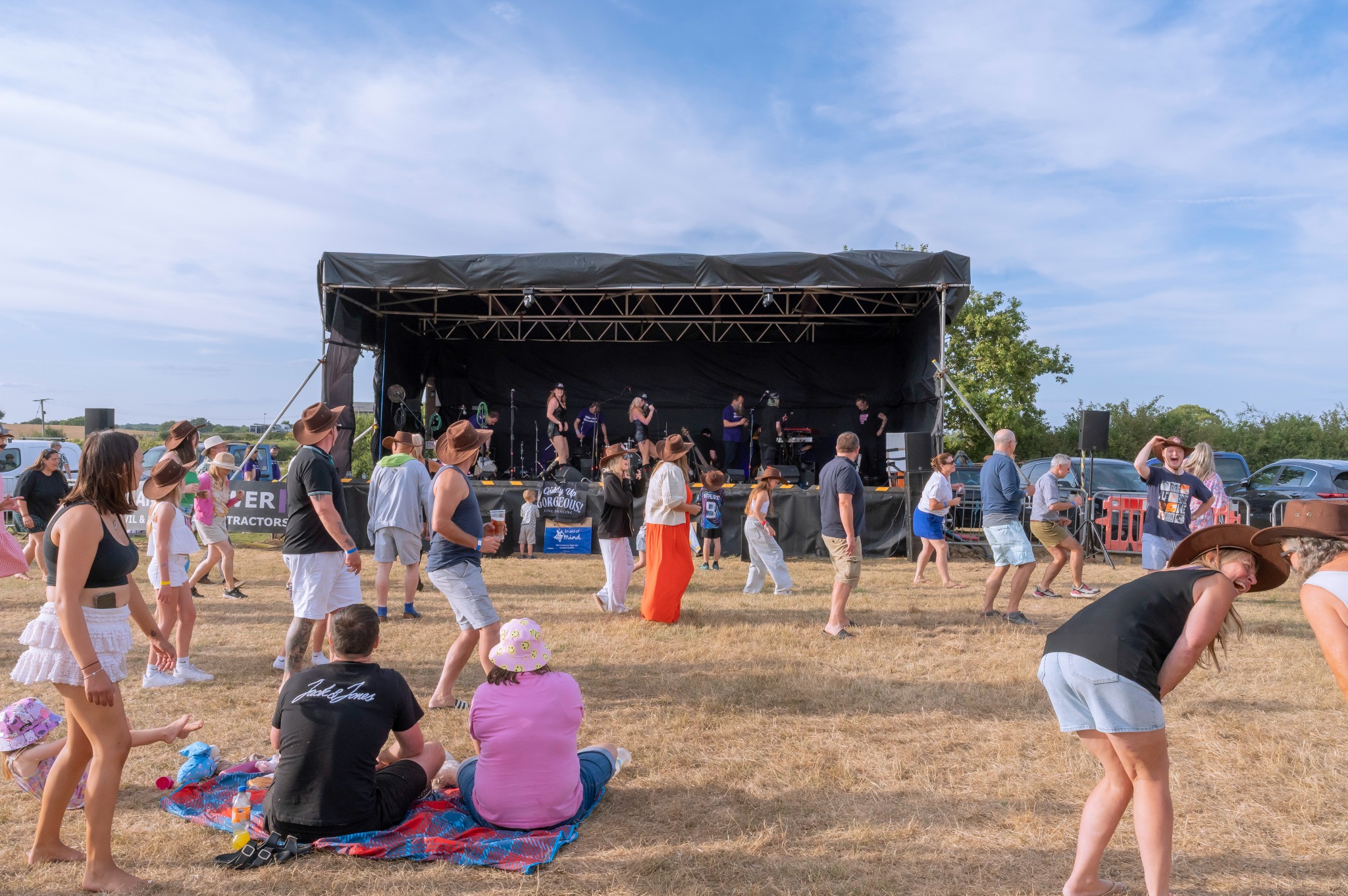 Truleigh Farm Fest stage and visitors in the festival field