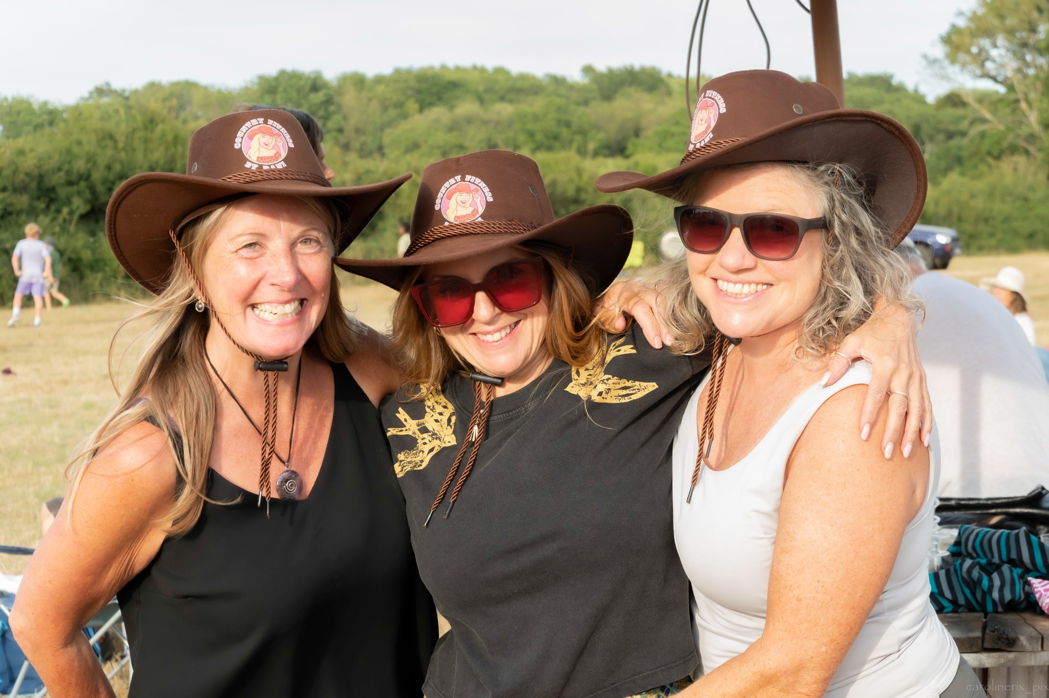 Friends wearing festival cowboy hats at Truleigh Farm Fest 2026