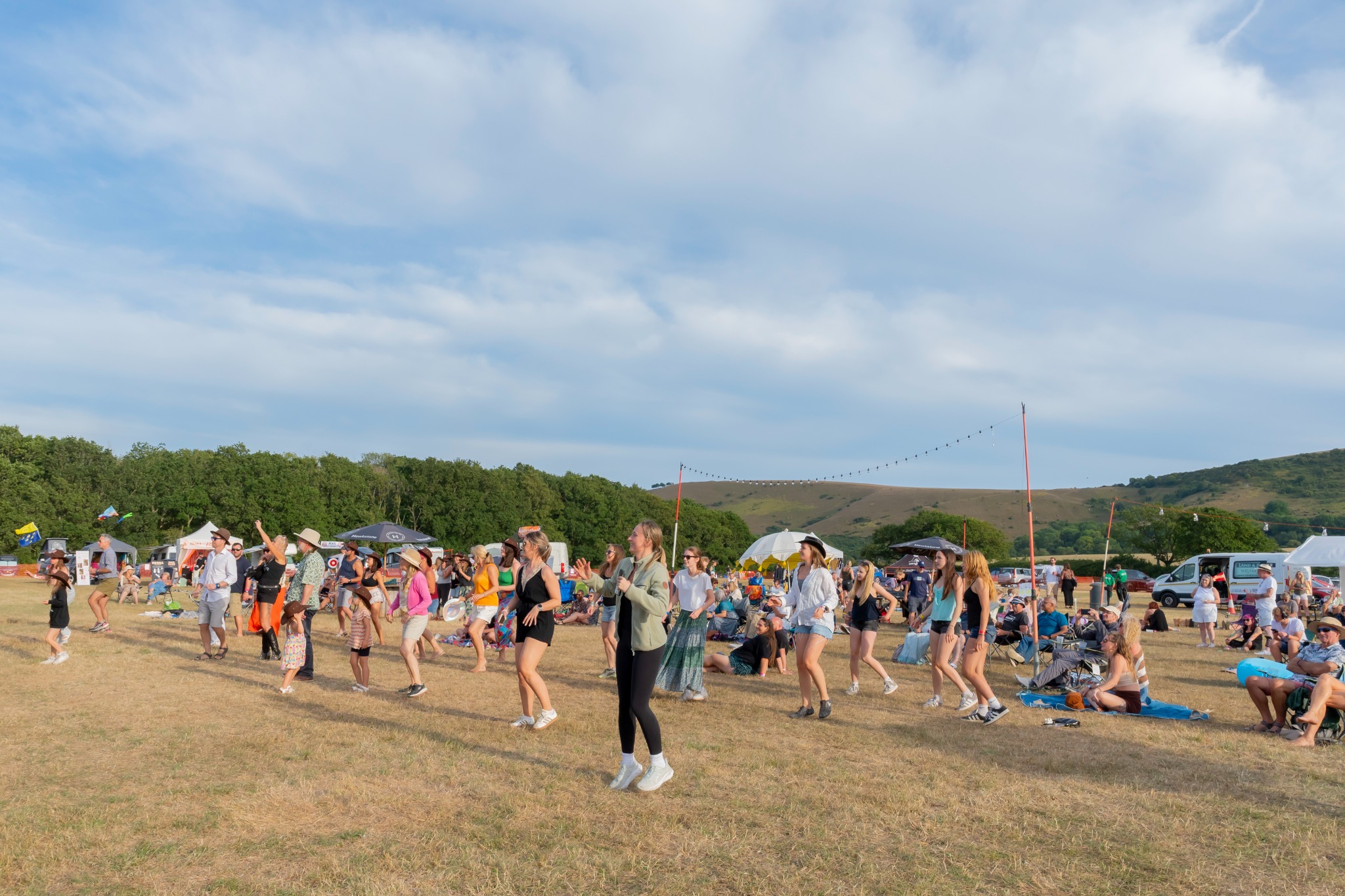 Festival visitors line dancing in front of the stage at Truleigh Farm Fest 2026