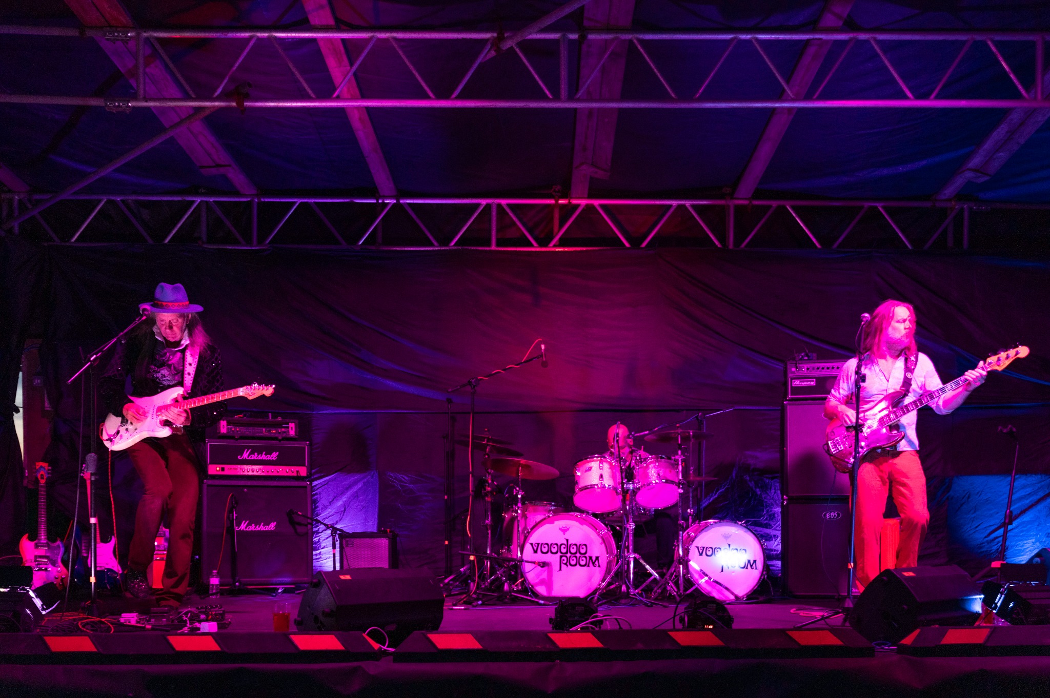 Voodoo Room performing under stage lights at Truleigh Farm Fest 2026